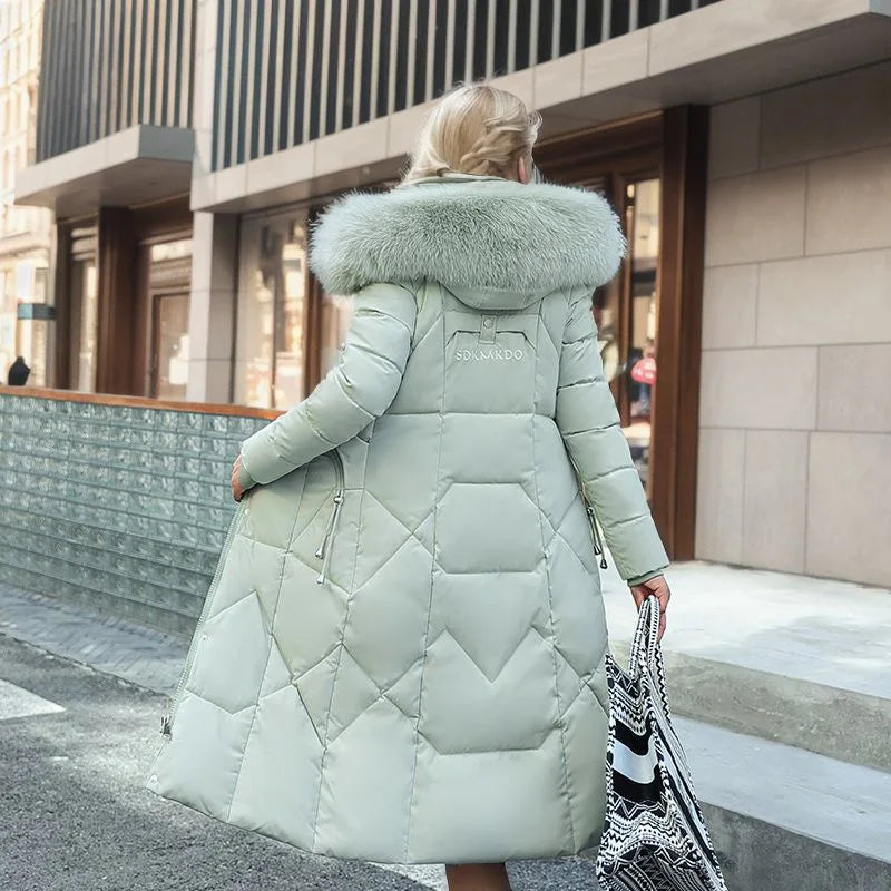 Padded long coat - stylish ladies winter jacket with faux fur collar