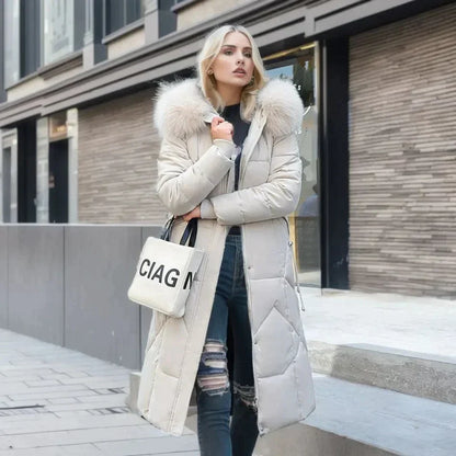 Padded long coat - stylish ladies winter jacket with faux fur collar