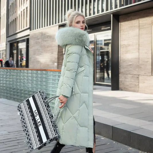 Padded long coat - stylish ladies winter jacket with faux fur collar